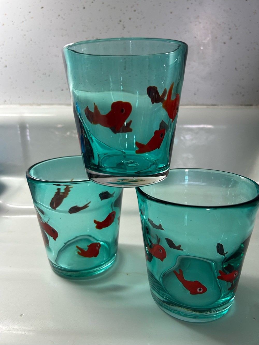 Anthropologie Teal Glass Tumblers with Orange Fish Motif